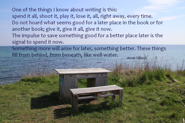 Wodden bench and desk standing on a low cliff atop the sea.